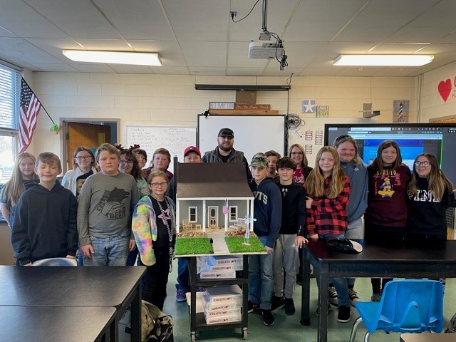 students with model houses