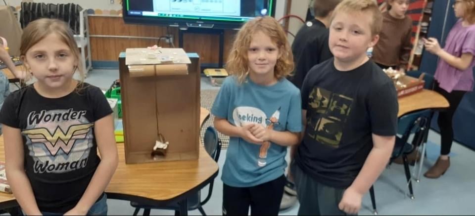 students in a  group showing off project