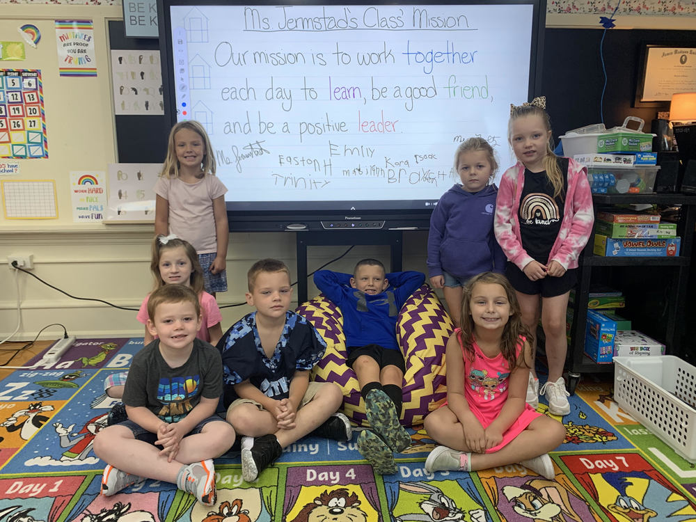 students in front of promethean board