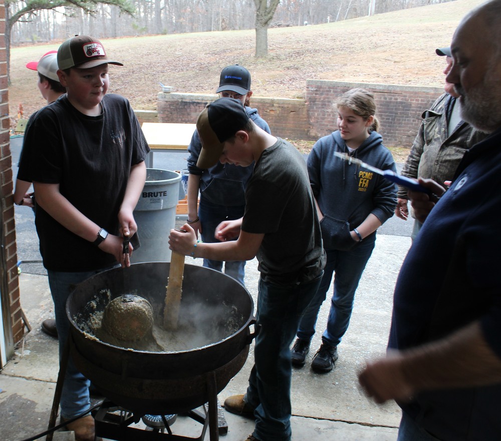 students making apple butter and cider