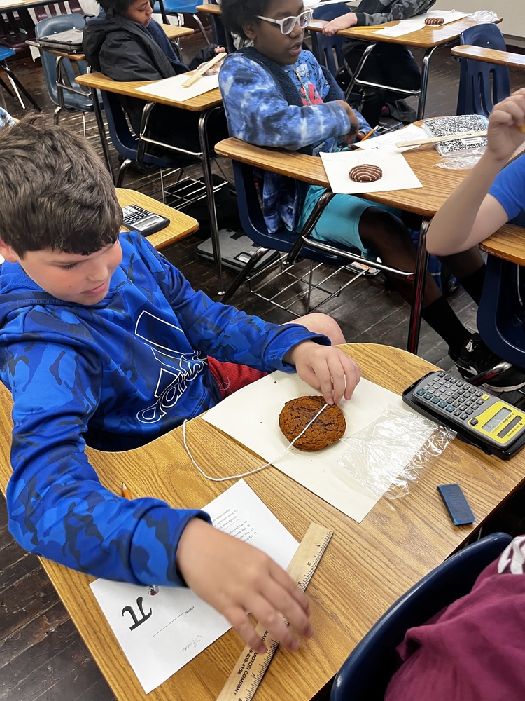 Student using oatmeal pie to derive Pi