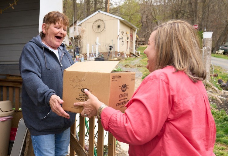 Food Being Presented to Community Member
