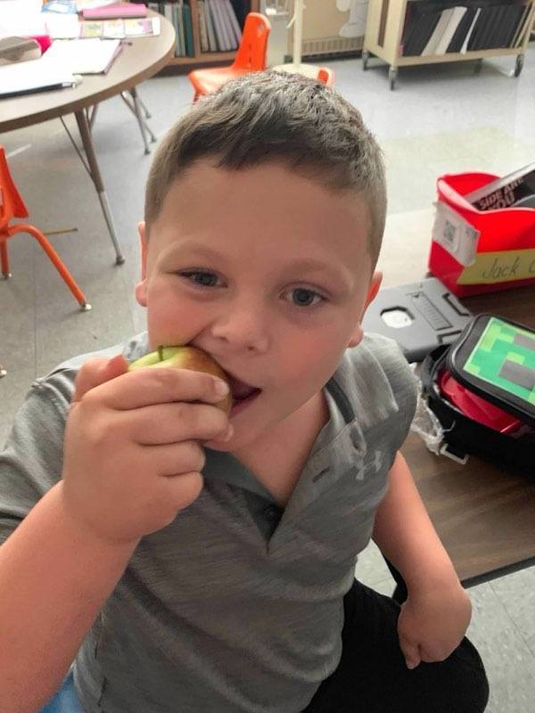 Student crunching an apple