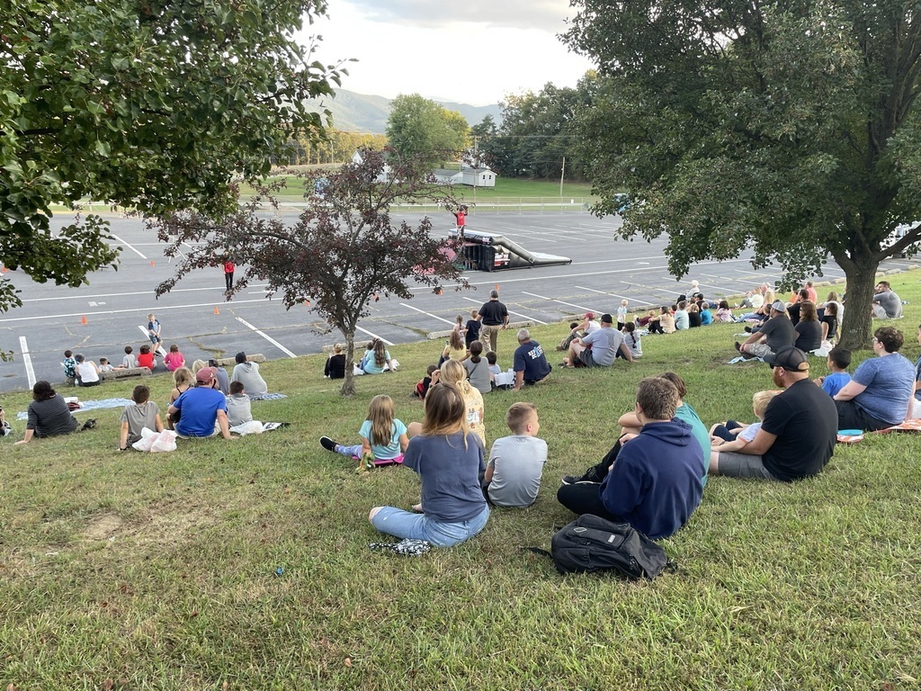 students watching bmx performance
