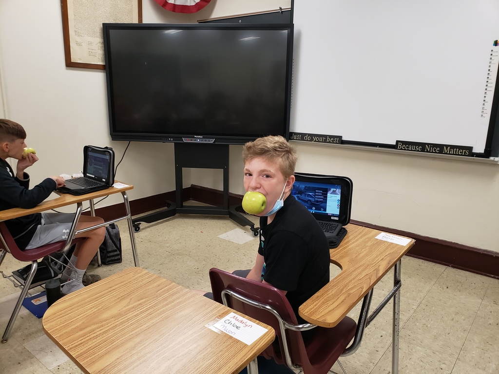students eating apples